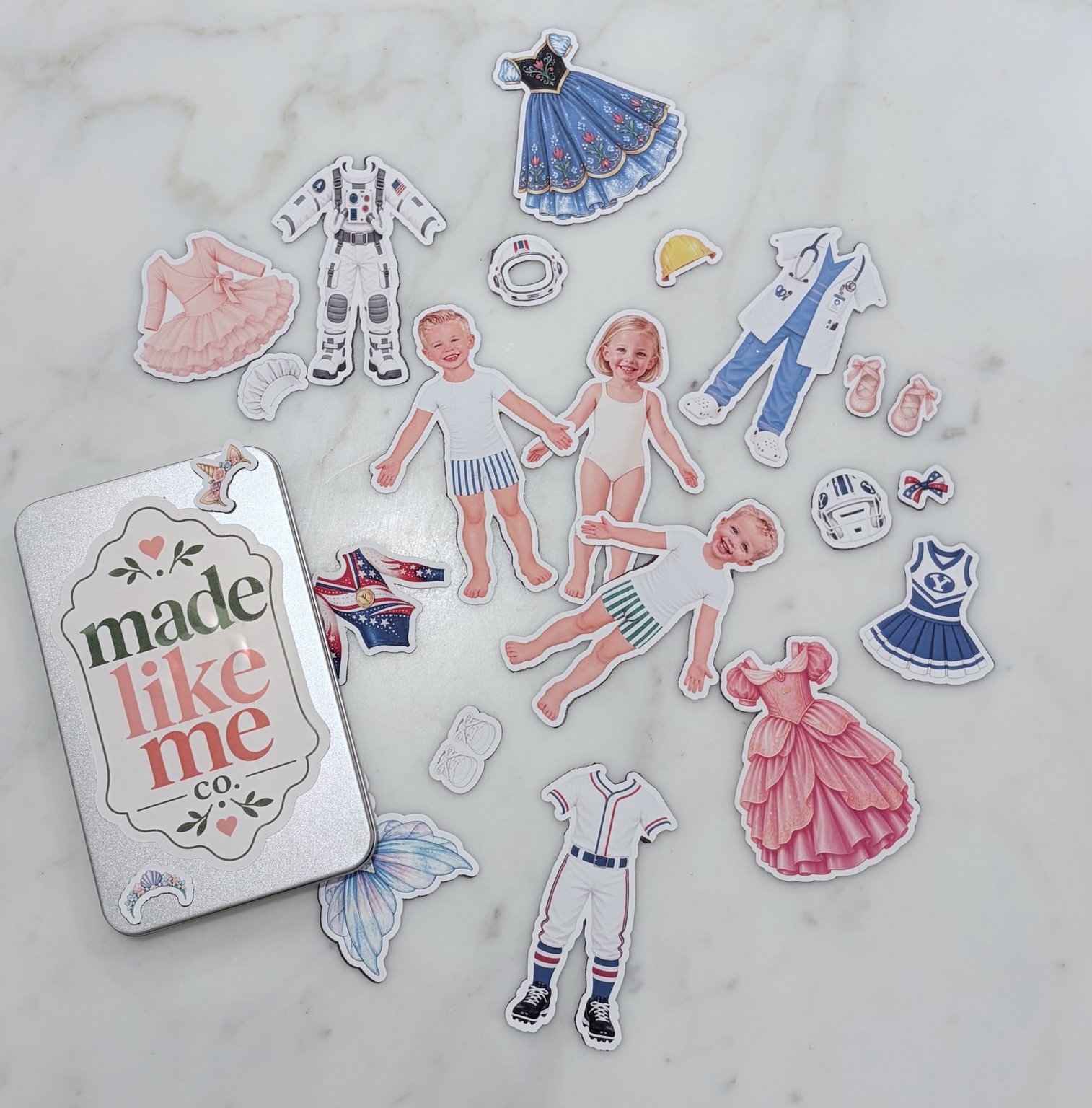 Three custom magnetic paper dolls laid out together